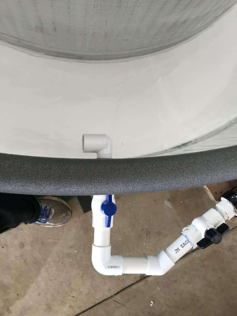 The inlet fitting positioned to control water current direction in the tank, view 2.